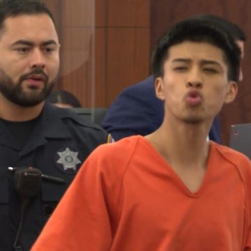 Teen accused of ‘retaliation’ murder of man whose stepdaughter rejected his advances blows kisses in court as victim’s family looks on