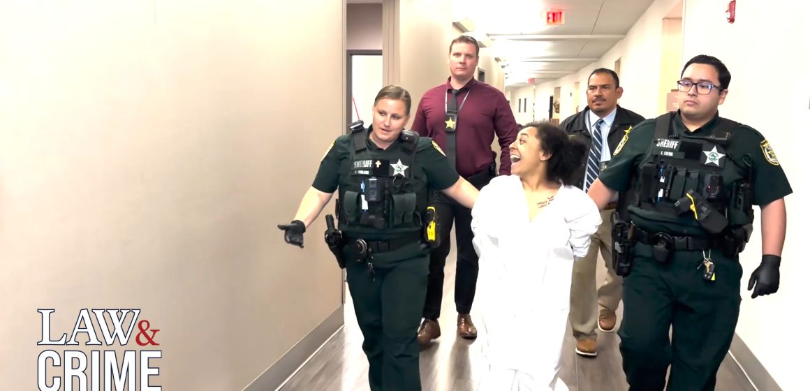 Video shows Florida mom smiling for perp walk after 14-year-old daughter found submerged in bathtub