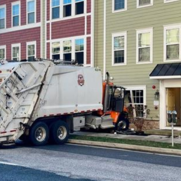 Towson Building Struck by Trash Truck in Early Morning Accident