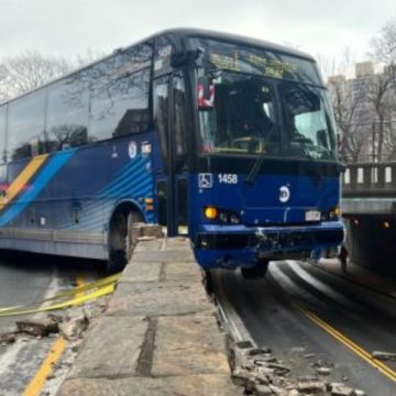 NYC Bus Driver Crashes Into Stone Wall, Front End Hanging Over Road With No Injuries Reported