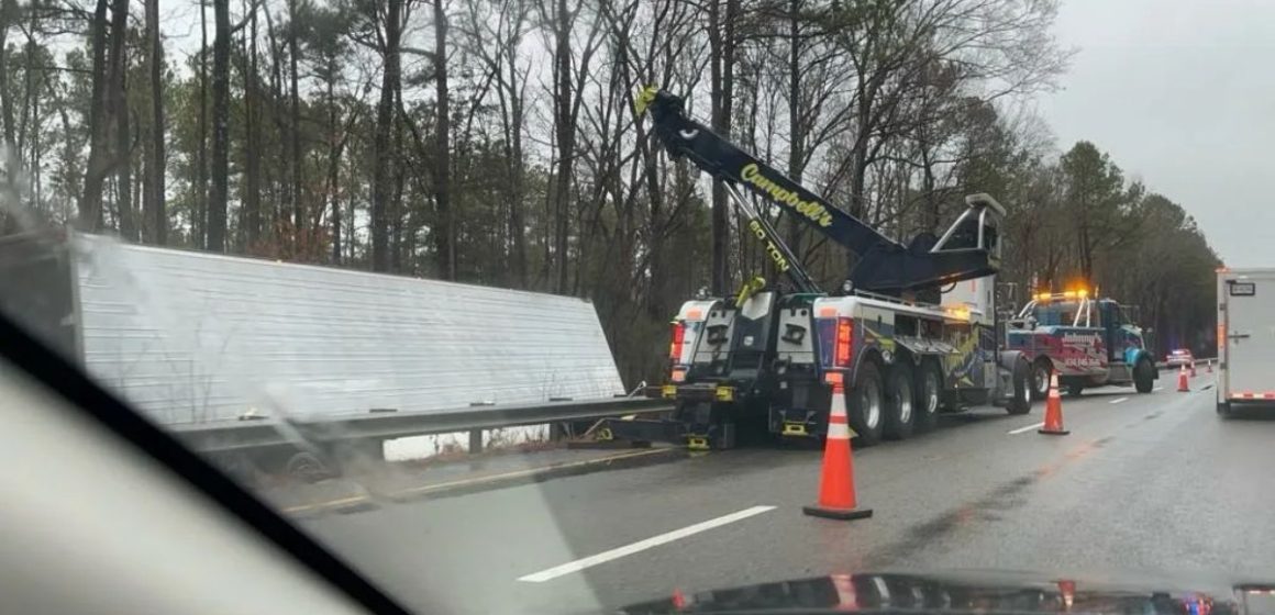 Tractor-Trailer Overturns on I-85 in Durham, Driver Hospitalized amid Dangerous NC Road Conditions